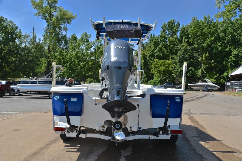 Slide: The Image of 2019 NauticStar 215 XTS Shallow Bay boat with Yamaha engine, parked outdoors. - 13
