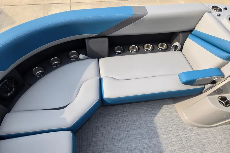 Slide: The Image of The image shows a modern boat seat with blue and gray upholstery and cup holders. - 5