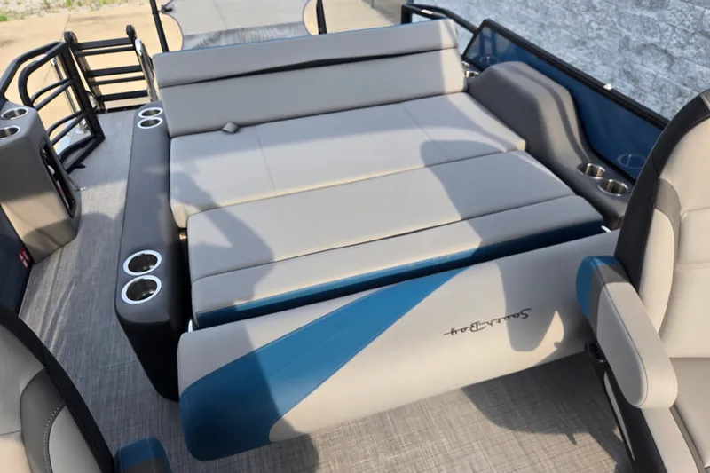 Slide: The Image of The image shows the interior of a 2027 South Bay SS224UL3.0 boat with gray and blue seating. - 12