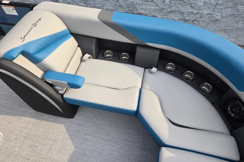 Slide: The Image of The image shows a modern, cushioned seating area in blue and gray on a boat. - 4