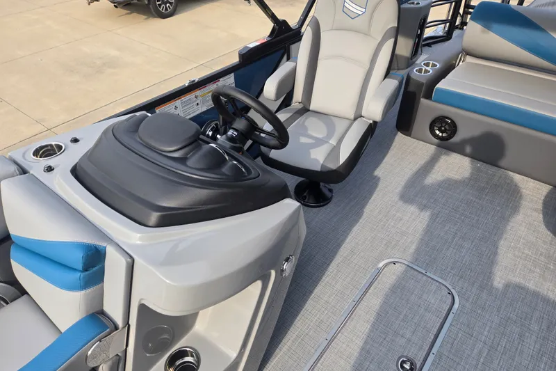 Slide: The Image of The image shows the cockpit of a 2027 South Bay SS224UL3.0 with gray and blue seating. - 6