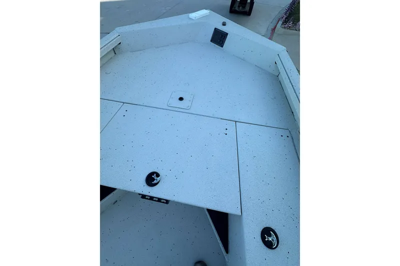 Slide: The Image of 2024 Ranger RB190 Bay boat deck with storage compartments and anchor holders. - 18