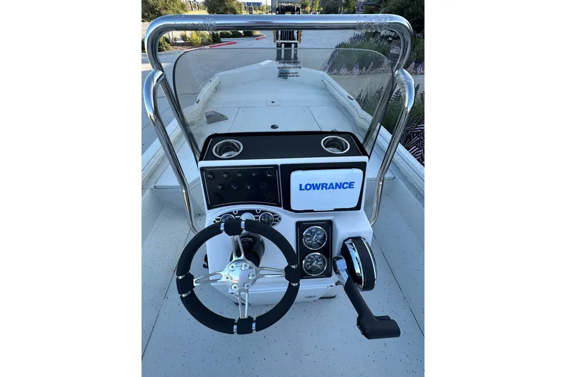 Slide: The Image of 2024 Ranger RB190 Bay boat console with steering wheel and Lowrance electronics. - 13