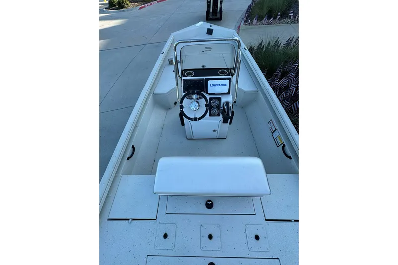 Slide: The Image of 2024 Ranger RB190 Bay boat interior with steering console and Lowrance electronics. - 10