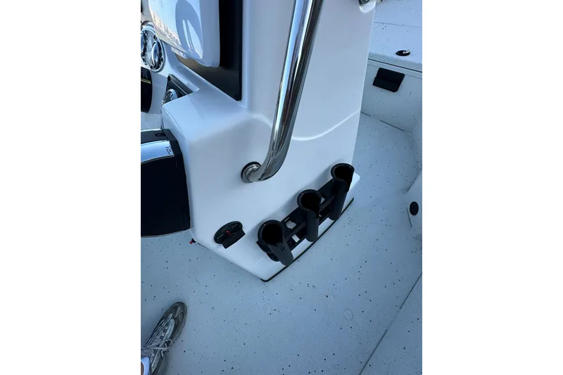 Slide: The Image of 2024 Ranger RB190 Bay boat console with rod holders and stainless steel railing. - 14
