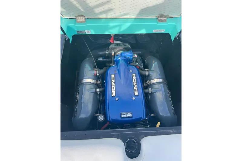 Slide: The Image of 2018 MasterCraft XT23 engine compartment featuring Ilmor 5000 MPI engine. - 12