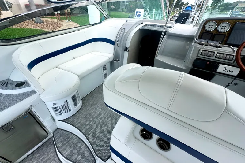Slide: The Image of Interior of a 2008 Formula 37 Performance Cruiser with white seating and modern dashboard. - 7