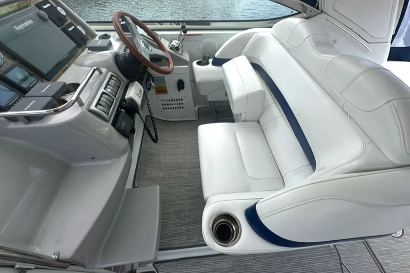 Slide: The Image of 2008 Formula 37 Performance Cruiser cockpit with white seating and modern controls. - 8
