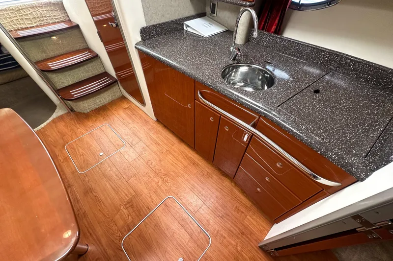 Slide: The Image of Interior of 2008 Formula 37 Performance Cruiser with sleek kitchen and wooden flooring. - 10