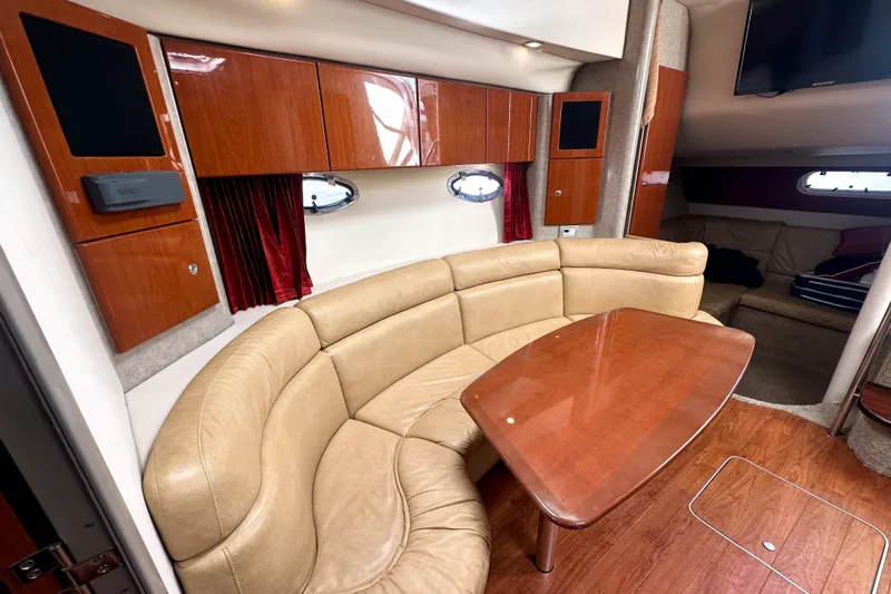 Slide: The Image of Luxurious interior of 2008 Formula 37 Performance Cruiser with leather seating and wooden cabinetry. - 12