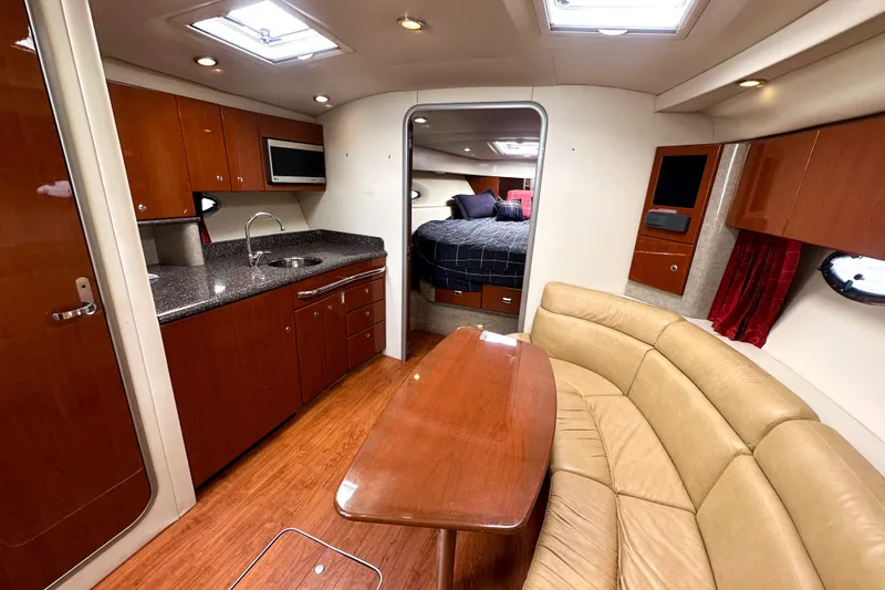 Slide: The Image of Interior of a 2008 Formula 37 Performance Cruiser with kitchen, seating, and sleeping area. - 11