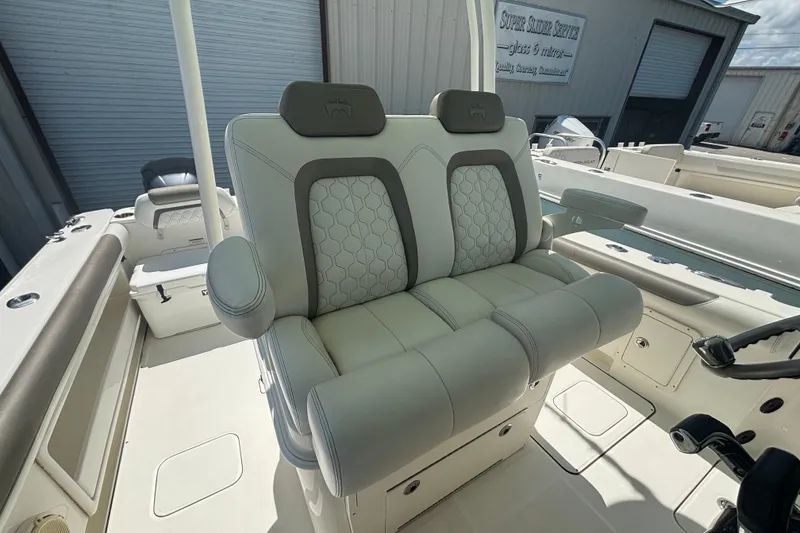 Slide: The Image of 2021 World Cat 295 CC boat interior with dual cushioned seats and modern design. - 8