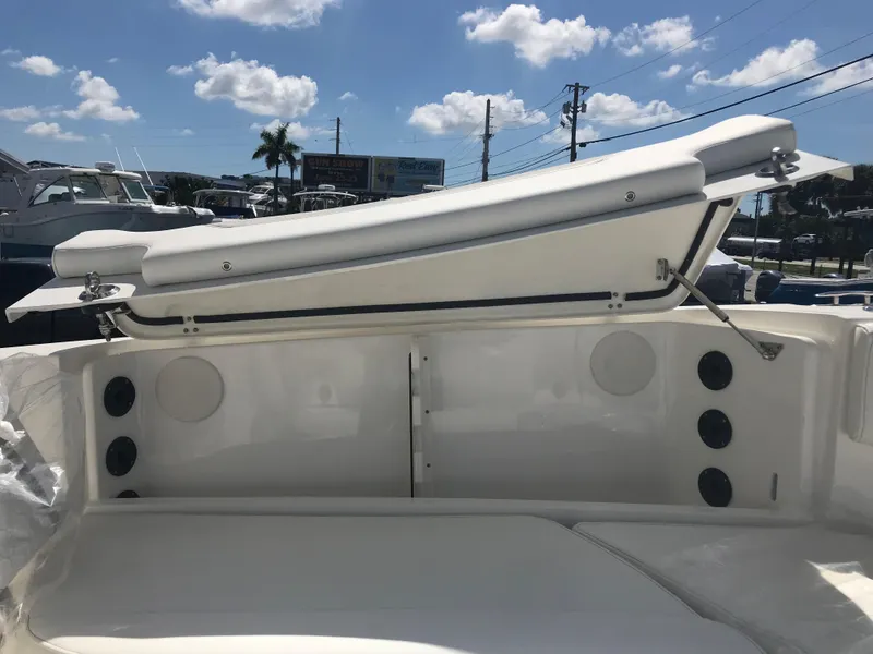 Slide: The Image of The image shows the stern of a World Cat 295 CC boat with seating and speakers. - 20