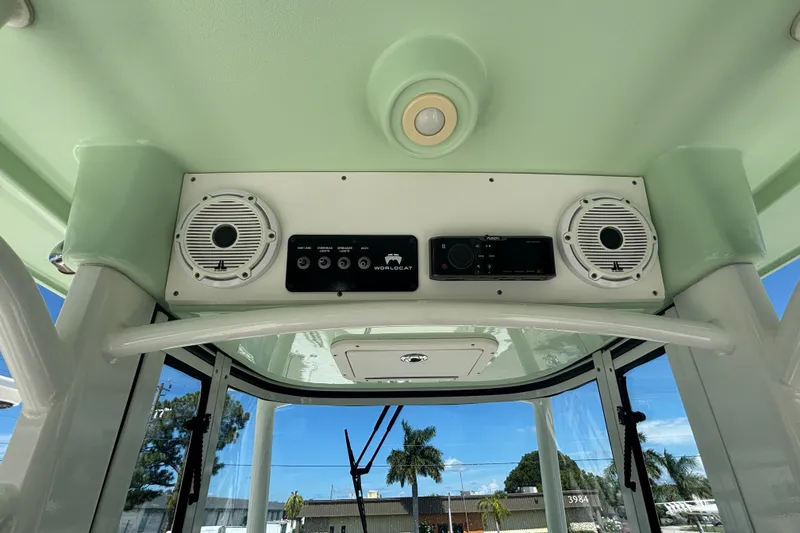 Slide: The Image of 2021 World Cat 295 CC boat interior with speakers and control panel. - 10