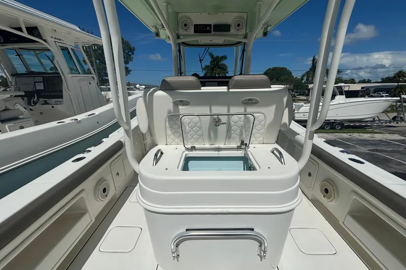 Slide: The Image of 2021 World Cat 295 CC boat interior with seating and storage, showcasing modern design. - 5