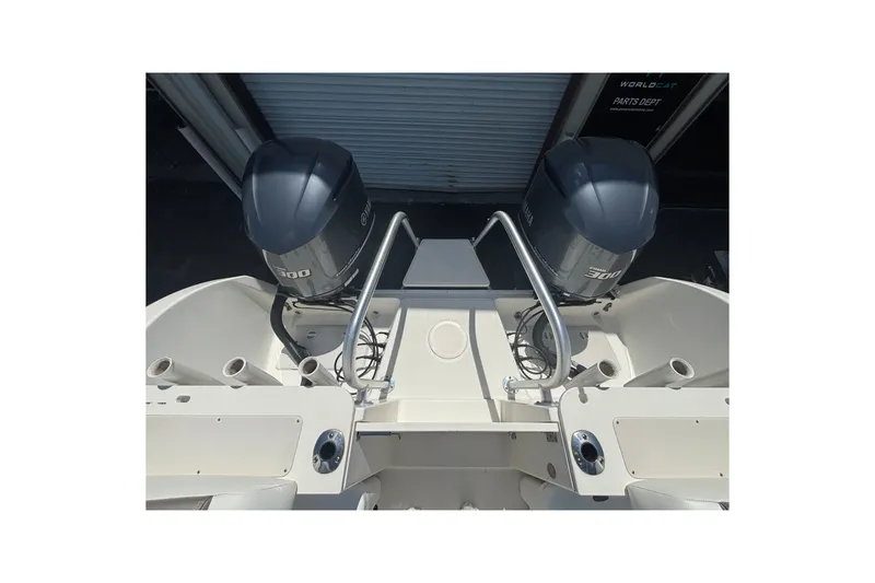 Slide: The Image of 2021 World Cat 295 CC boat with dual Yamaha 300 engines, viewed from the stern. - 18