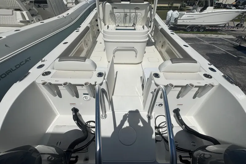 Slide: The Image of 2021 World Cat 295 CC boat interior with seating and rod holders. - 4
