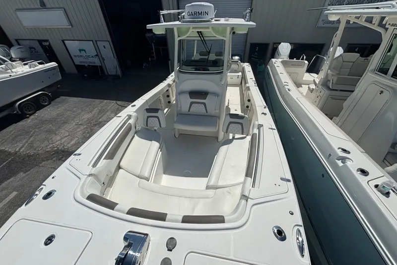 Slide: The Image of 2021 World Cat 295 CC boat with spacious seating and Garmin navigation system. - 16