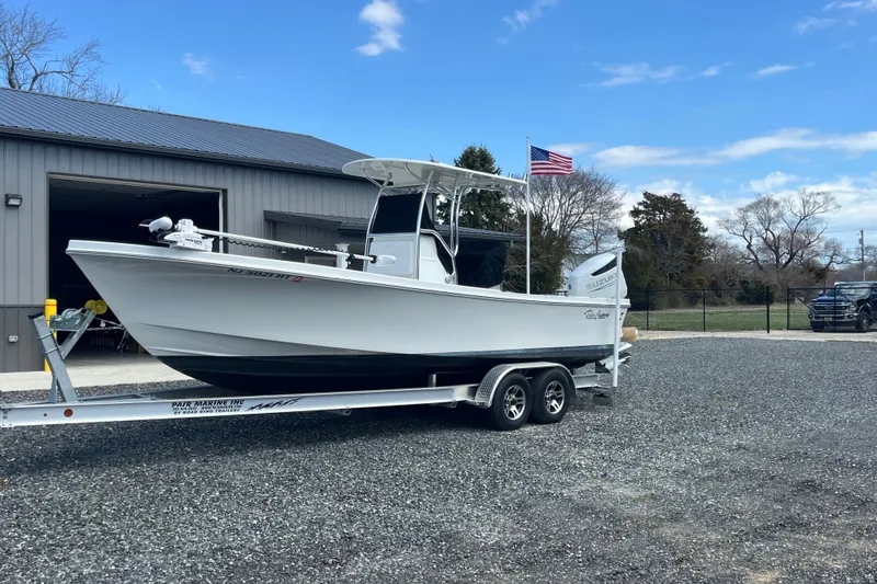 Slide: The Image of 2023 Pair Customs 24 Center Console DV boat on trailer, parked outdoors. - 4