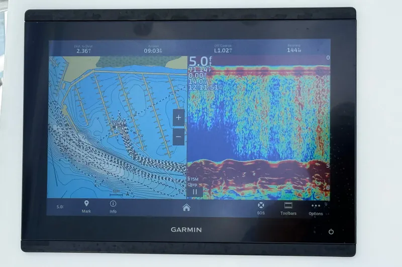 Slide: The Image of Garmin marine display showing navigation and sonar data on Pair Customs 2023 boat. - 7