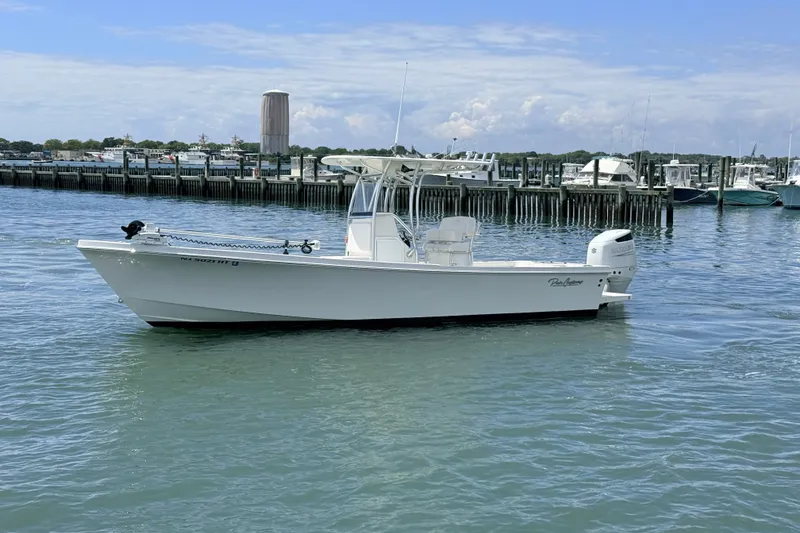 Slide: The Image of 2023 Pair Customs 24 Center Console DV boat docked in a marina. - 3