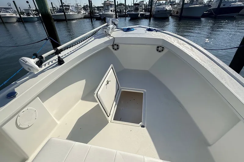 Slide: The Image of 2023 Pair Customs 24 Center Console DV boat interior at marina. - 20