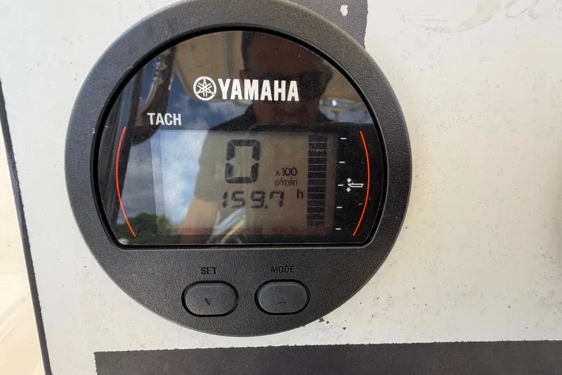 Slide: The Image of Yamaha tachometer displaying 159.7 hours on a 2017 Scout 195 Sportfish boat. - 12