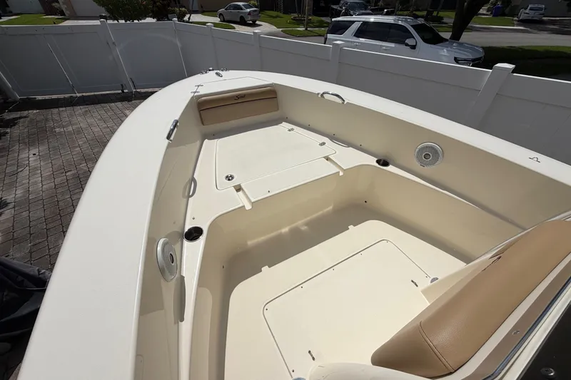 Slide: The Image of 2017 Scout 195 Sportfish boat interior with seating and storage compartments. - 13