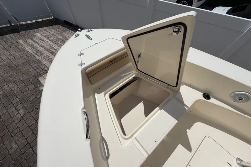 Slide: The Image of 2017 Scout 195 Sportfish boat with open storage compartment on deck. - 14
