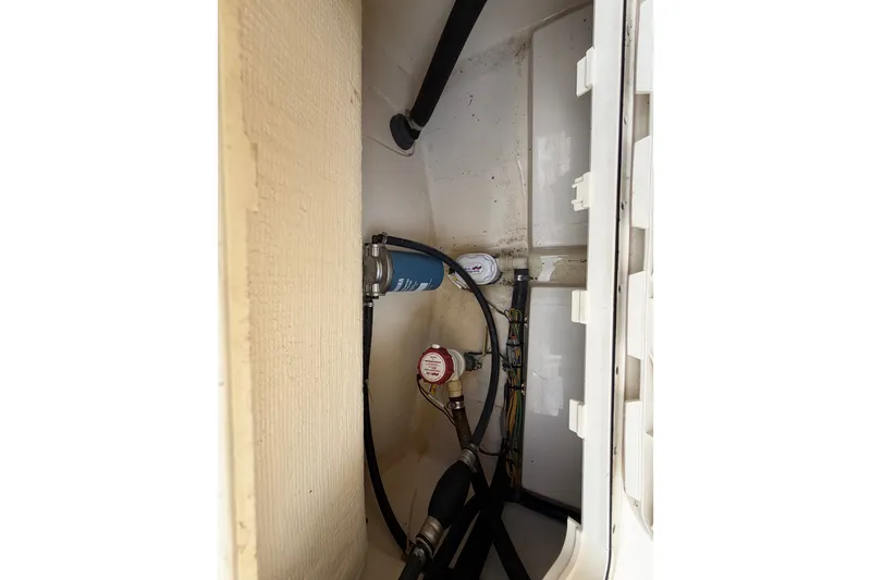 Slide: The Image of 2017 Scout 195 Sportfish boat interior wiring and plumbing components. - 23