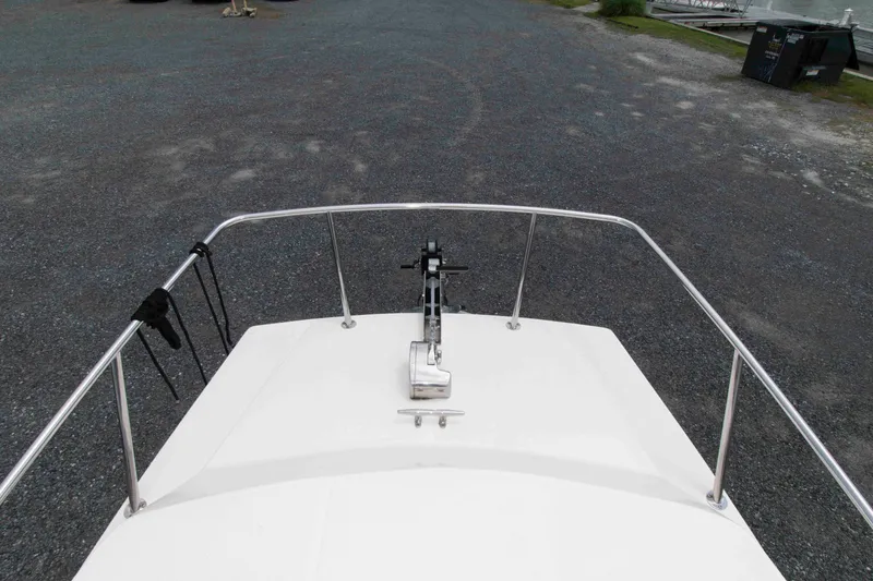 Slide: The Image of Bow view of 2007 C-Dory 25' Tomcat Catamaran on gravel surface. - 10