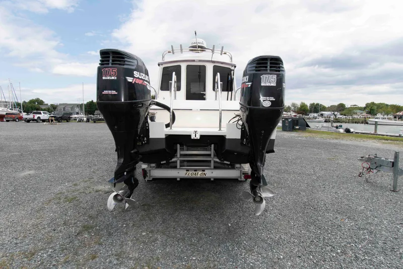 Slide: The Image of 2007 C-Dory 25' Tomcat Catamaran with twin Suzuki 175 engines on a trailer. - 21