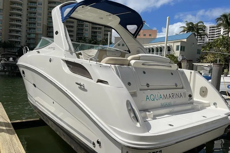 The Image of 2012 Sea Ray Sundancer 310 yacht docked in Miami marina, featuring sleek design and luxury amenities. - 0