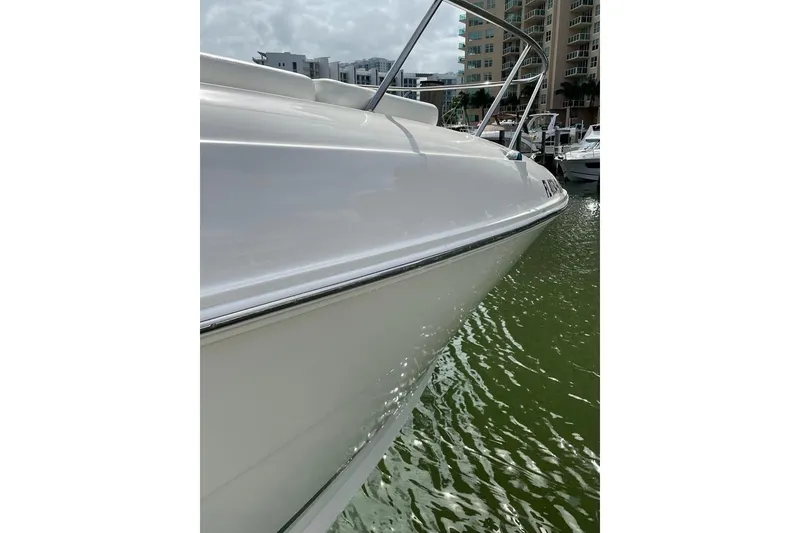 Slide: The Image of 2012 Sea Ray Sundancer 310 yacht docked in marina, side view. - 5
