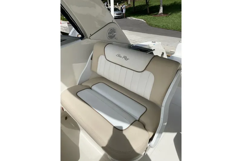 Slide: The Image of 2012 Sea Ray Sundancer 310 boat seat with beige and white upholstery. - 16