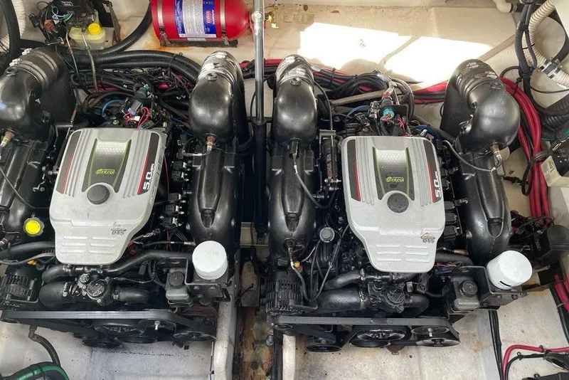 Slide: The Image of Twin engines in a 2012 Sea Ray Sundancer 310 boat engine compartment. - 21
