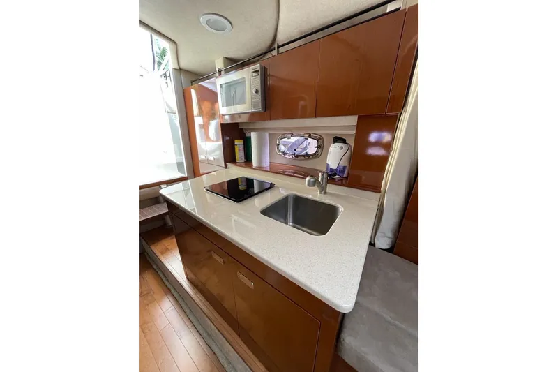 Slide: The Image of Modern galley kitchen in 2012 Sea Ray Sundancer 310 yacht with sink and microwave. - 8