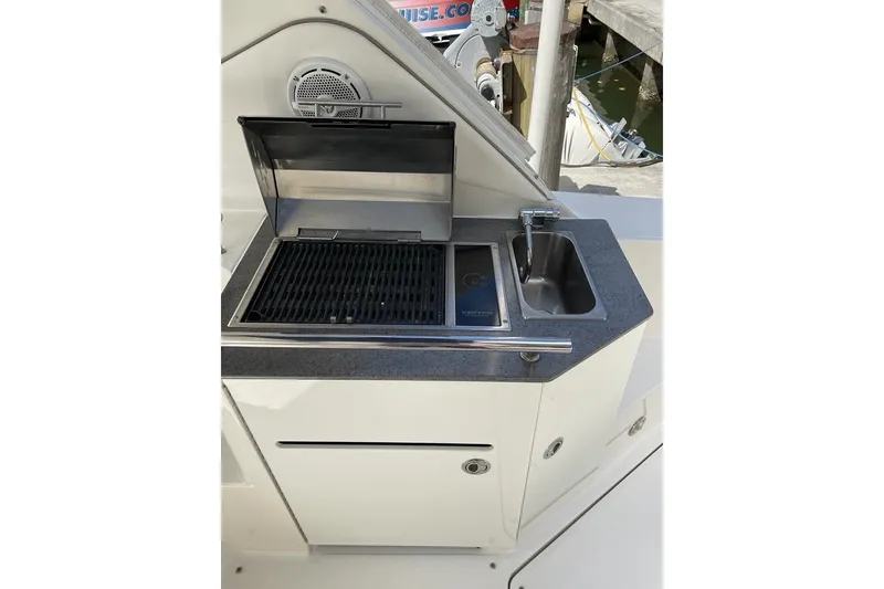 Slide: The Image of Outdoor kitchenette on 2012 Sea Ray Sundancer 310 yacht with grill and sink. - 15