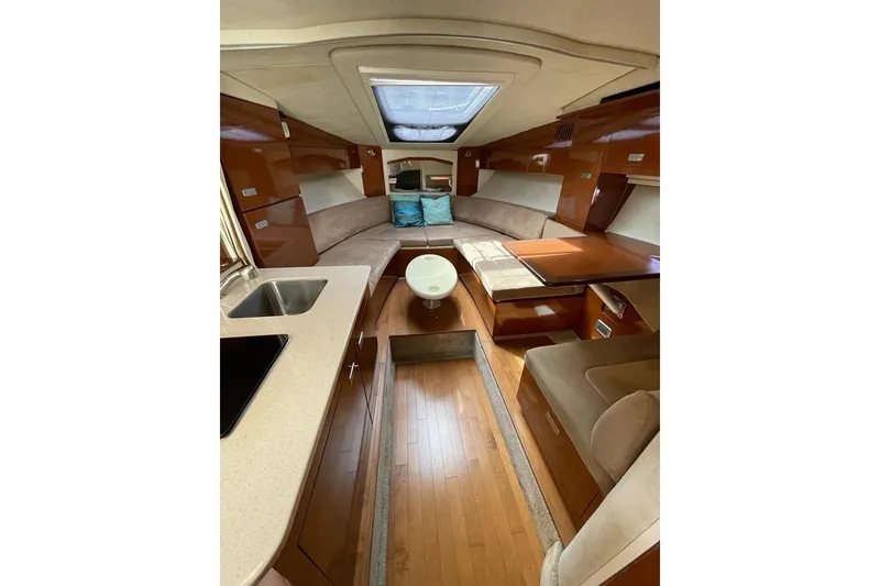 Slide: The Image of Luxurious interior of 2012 Sea Ray Sundancer 310 yacht with elegant seating and modern amenities. - 12