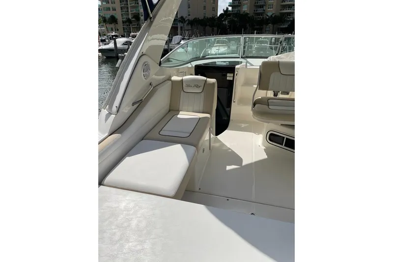 Slide: The Image of 2012 Sea Ray Sundancer 310 interior with plush seating and sleek design. - 17