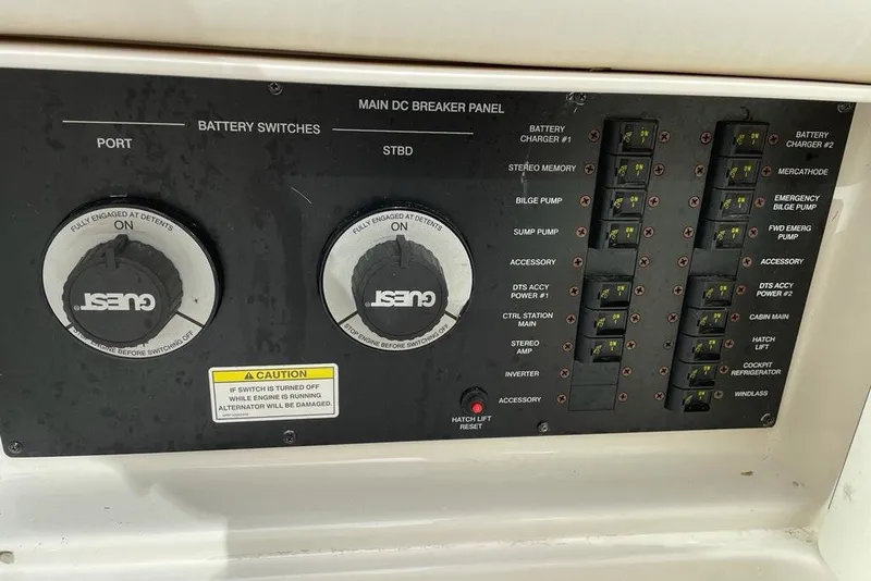 Slide: The Image of Control panel of a 2012 Sea Ray Sundancer 310 boat with battery switches and breakers. - 19