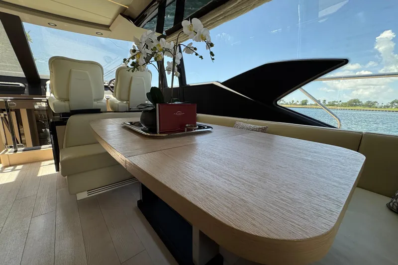 Slide: The Image of Luxurious interior of 2018 Azimut 66 Flybridge yacht with elegant seating and table. - 25