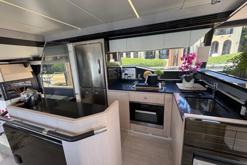 Slide: The Image of Luxurious 2018 Azimut 66 Flybridge yacht kitchen with modern appliances and elegant design. - 26