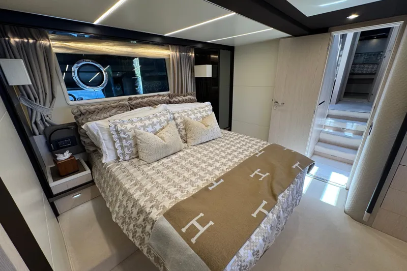 Slide: The Image of Luxurious bedroom interior of 2018 Azimut 66 Flybridge yacht with elegant bedding and modern design. - 34