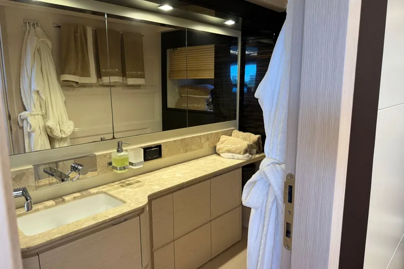 Slide: The Image of Luxurious bathroom in 2018 Azimut 66 Flybridge yacht with elegant fixtures and plush towels. - 36
