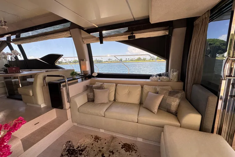 Slide: The Image of Luxurious interior of 2018 Azimut 66 Flybridge yacht with elegant seating and scenic water view. - 21