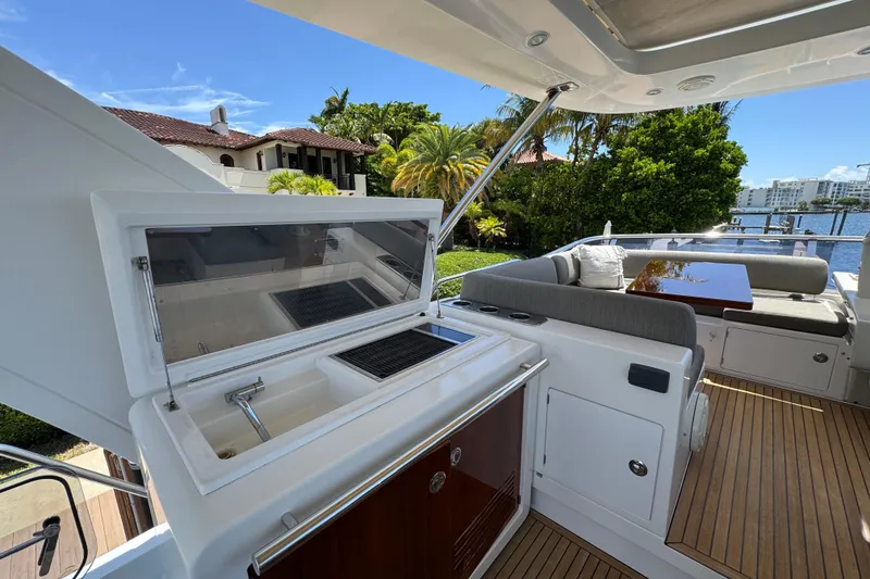Slide: The Image of Flybridge of 2018 Azimut 66 yacht with outdoor kitchen and seating area. - 19
