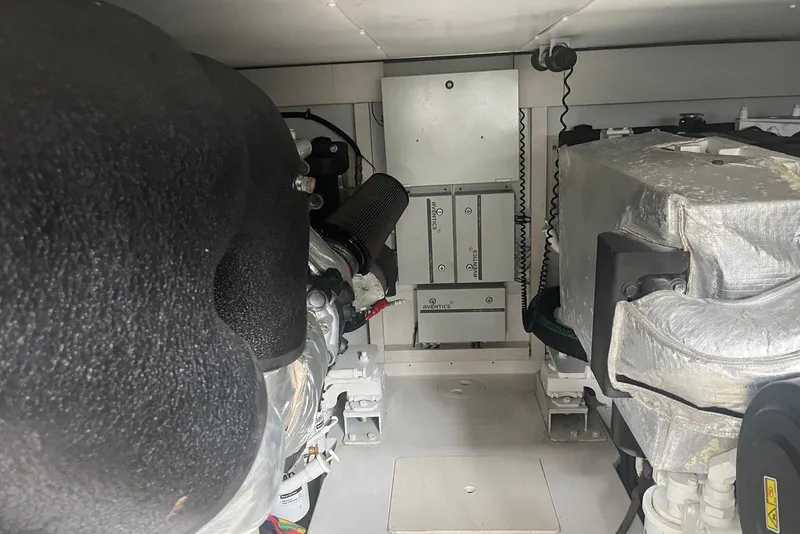 Slide: The Image of Engine room of a 2018 Azimut 66 yacht, showcasing mechanical components and systems. - 57