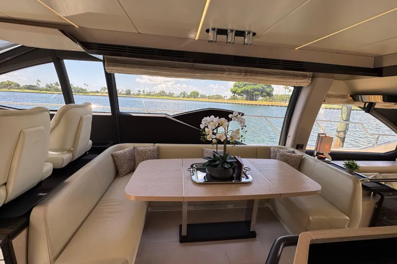 Slide: The Image of Luxurious interior of 2018 Azimut 66 Flybridge yacht with elegant seating and scenic water view. - 24
