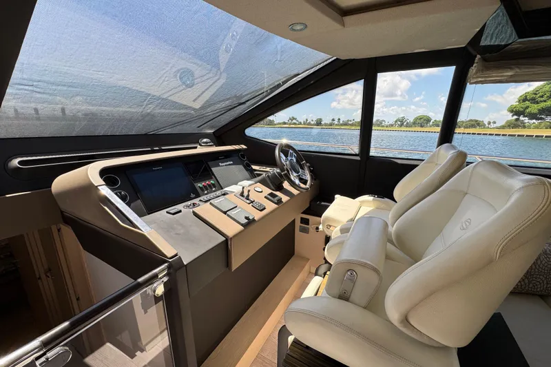 Slide: The Image of Luxurious 2018 Azimut 66 Flybridge yacht cockpit with modern controls and plush seating. - 28